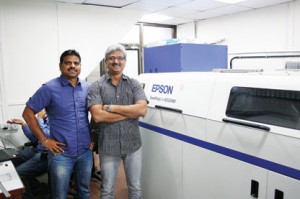 L–R: Anil Namugade & Milind Deshpande, Managing Partners of Trigon Digital Solutions along with the Epson SurePress L-4033AW in Mumbai