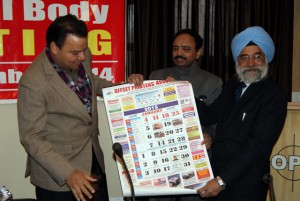 The annual calendar of OPA being released by Shri S S Dhillon and Parveen Aggarwal